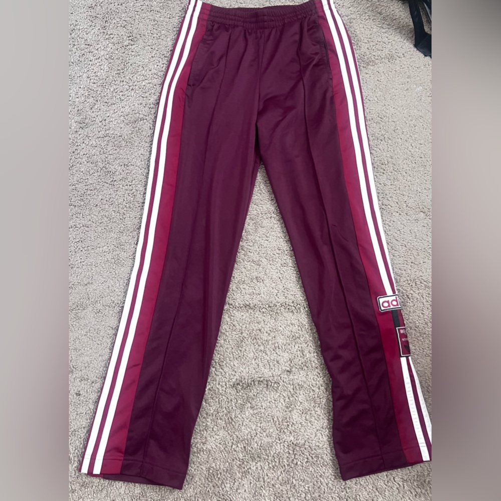 Adidas sweatpants with buttons on the side
